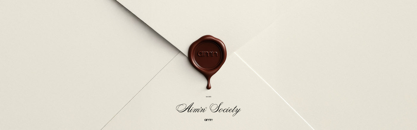 A secret envelope with Aim'n stamp hiding upcoming news on a website.